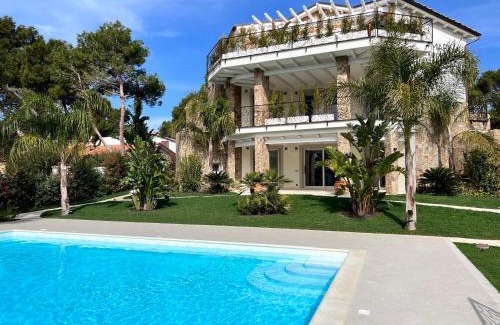 Porto Pino Apartment | Experience Suite Villa Corallo Rosso: 4-Star Oceanfront Retreat