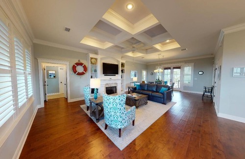 Port St. Joe House | Summer Bay, a beautiful Bay View Home private backyard oasis around the swimming pool, screened porch, and sundeck