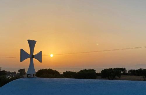 Theologos Hotel | Idyllic Summer View: Poolside Retreat with Oceanfront Bliss
