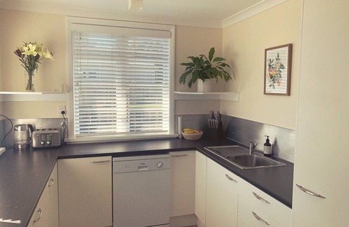 Waitarere Beach House | Experience Sun Kissed Beach Haven with Oceanfront Amenities