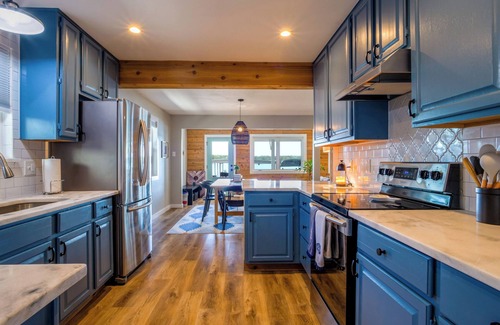 Granite Shoals House | Sun rays & lake waves on Lake LBJ! Lakefront, hot tub, SUP, fire pit, games!