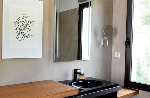 Aubais Villa | Relax in a Heated Pool with Ocean Views and Spa Amenities