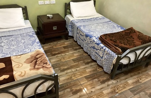 Jabal Al-Hussein Hotel | Relax at Sun Rise Hotel with Restaurant & Family Amenities