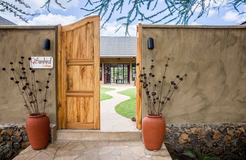 Arusha Cottage | Sunbird Cottage: Exclusive Retreat on Scenic Golf Course