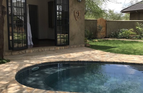 Arusha Cottage | Sunbird Cottage: Exclusive Retreat on Scenic Golf Course