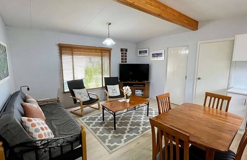 Broadwater Cabin | Cozy Sundowner Cabin with Oceanfront Views and Pool