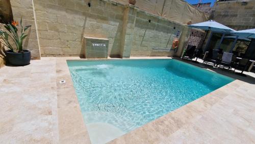 Xewkija House | Enchanting Sunflower Farmhouse: Oceanfront Retreat & Pool