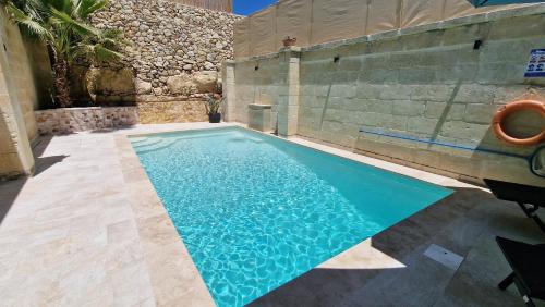 Xewkija House | Enchanting Sunflower Farmhouse: Oceanfront Retreat & Pool