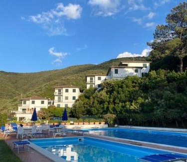 Procchio Apartment | Bright and Inviting Sunlight Apartment with Pool Access