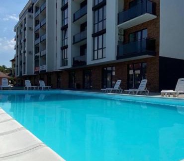 Polyana Apartment | Sunny-Apart: Family-Friendly Retreat with Pool Access