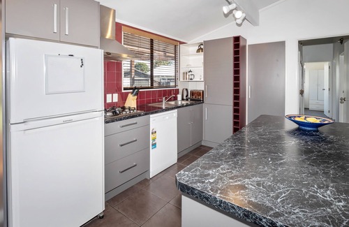 Papamoa Beach House | Relaxing Sunny Beach Bach with Oceanfront Serenity