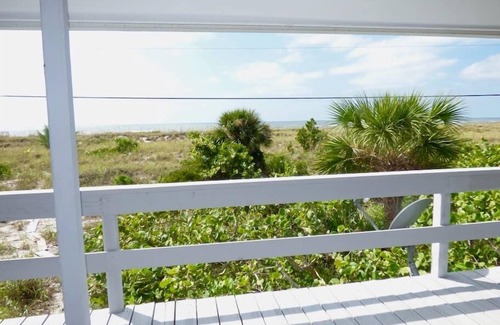 Placida House | Coastal Retreat: Beachfront Cottage with Private Dock