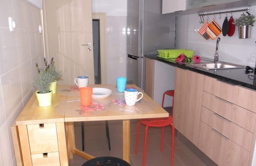 Penha de Franca Apartment | Bright Orange Garden Apartment in Central Lisbon - Rated 10/10