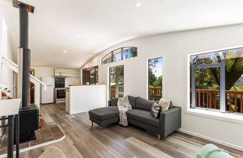 Bethells Beach House | Cozy Retreat Minutes From The Beach with Family Amenities