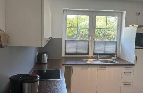 Albertsdorf Apartment | Sunny Sundblick accommodation with garden, terrace and wood-burning stove on Fehmarn