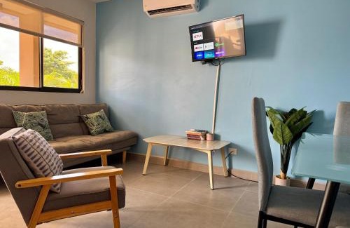 Coco House | Bright Tropical Condo with Rooftop Terrace & Ocean View