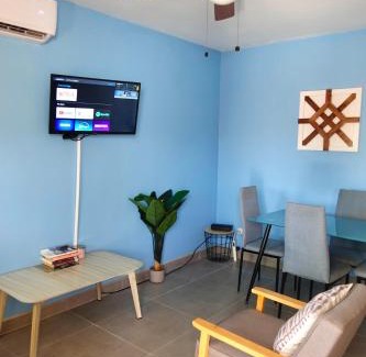 Coco House | Bright Tropical Condo with Rooftop Terrace & Ocean View