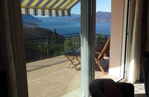 Dumenza House | Serene Vacation Apartment with Ocean View & Spa Amenities