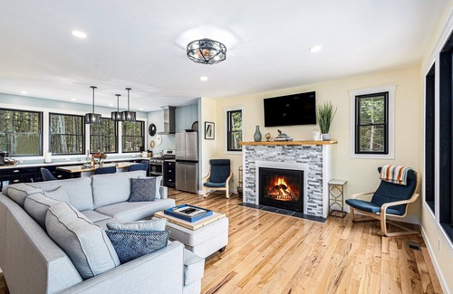 Kewadin House | Experience Sunrise Sands Retreat: Beachfront Oasis Awaits