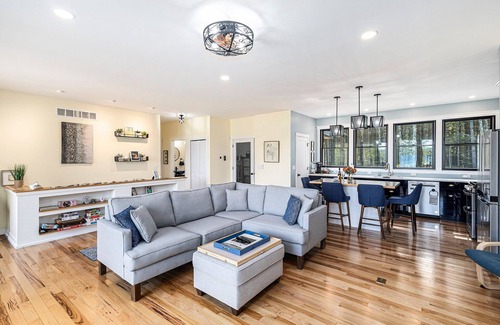 Kewadin House | Experience Sunrise Sands Retreat: Beachfront Oasis Awaits