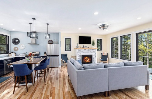 Kewadin House | Experience Sunrise Sands Retreat: Beachfront Oasis Awaits