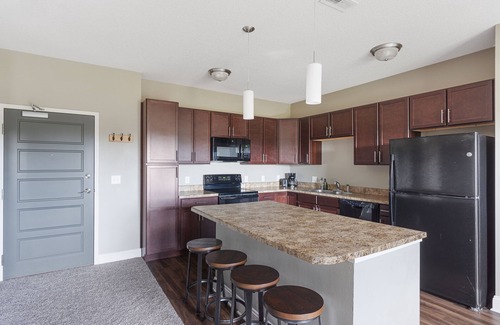 West Des Moines Apartment | Pet-Friendly Sunrise Serenity with Balcony & Pool Access