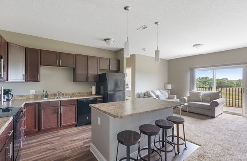 West Des Moines Apartment | Pet-Friendly Sunrise Serenity with Balcony & Pool Access