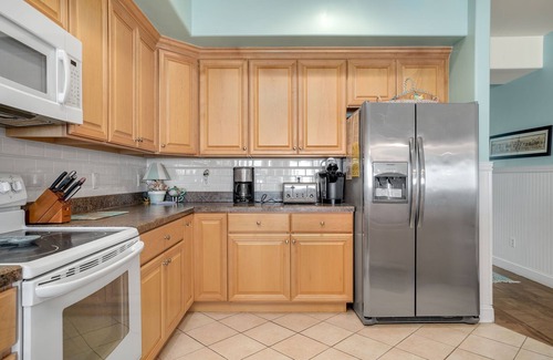 Chincoteague House | Elegant Sunset Bay Villa 206: Waterfront Retreat with Pool