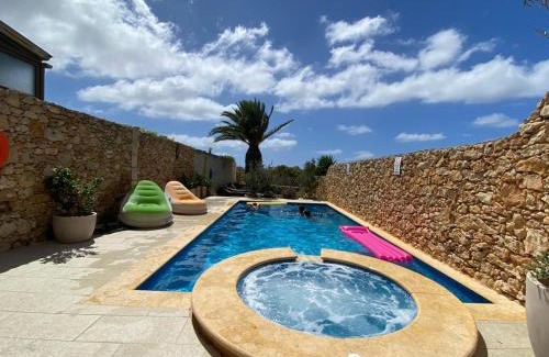 Gharb Villa | Experience Sunset Farmhouse: Pet-Friendly with Ocean Views