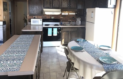 Town of Ledyard Cottage | Escape to Sunset Haven: Lakefront with Hot Tub & Waterslide