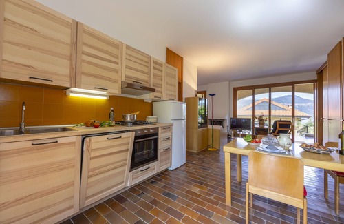 Ranco House | Pet-Friendly Getaway at Sunset in Ranco, Italy