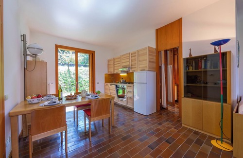 Ranco House | Pet-Friendly Getaway at Sunset in Ranco, Italy