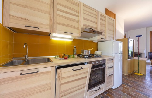 Ranco House | Pet-Friendly Getaway at Sunset in Ranco, Italy