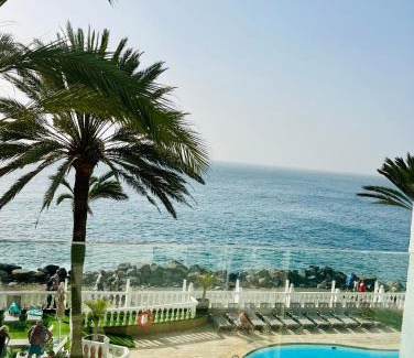 Arguineguin Apartment | Scenic Sunset Ocean View with Pool & Breakfast Included