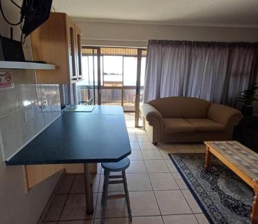 Jeffreys Bay Apartment | Oceanfront Sunset Sands: Family-Friendly Getaway Awaits