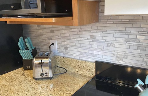 Dewittville Condo | Family-Friendly Sunset Shores Condo with Pool & Private Deck