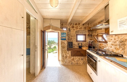 Torre Vado Villa | Oceanfront Stone House with Infinity Pool & Sunset Views