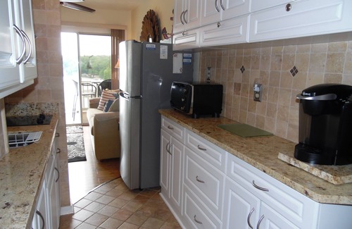 North Shore Condo | Exceptional Sunset Views: Waterfront Penthouse with Boat Slip