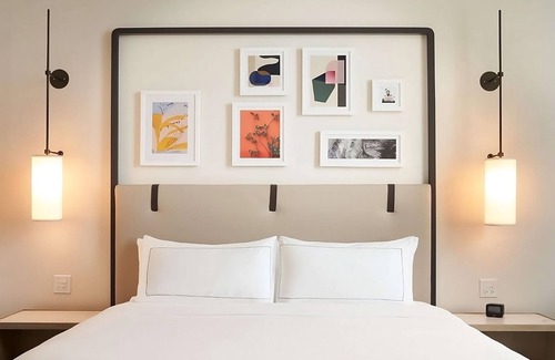 Ojus Hotel | Relax at Our Beachfront Oasis with Rooftop Pool & Kitchenette