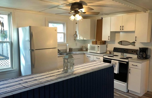 Coldwater House | Experience Breathtaking Sunsets with Lake View Amenities