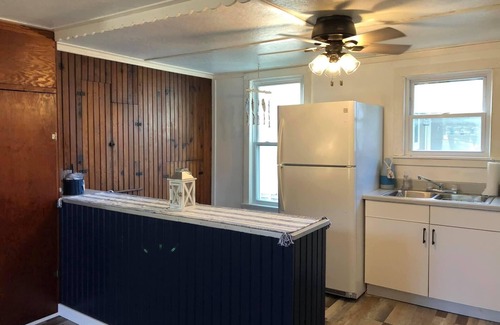 Coldwater House | Experience Breathtaking Sunsets with Lake View Amenities
