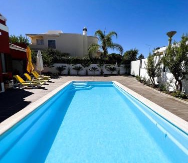 Gambelas Villa | Experience Sunshine Villa: Oceanfront Bliss & Guest Rated 9.8