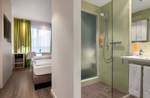 Oberhausen Hotel | Discover Super 8 by Wyndham Oberhausen: Eco-Friendly Comfort