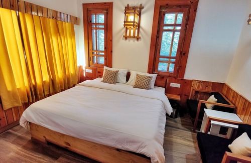 Theog Hotel | Indulge in Our Super Deluxe Room with Mountain View & Balcony