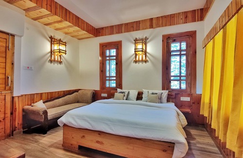 Theog Hotel | Indulge in Our Super Deluxe Room with Mountain View & Balcony