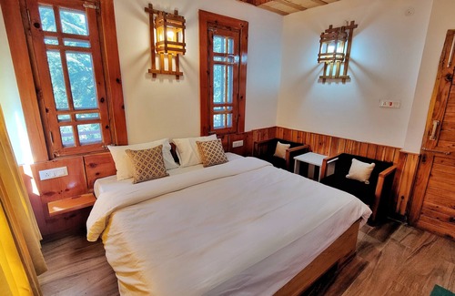 Theog Hotel | Indulge in Our Super Deluxe Room with Mountain View & Balcony
