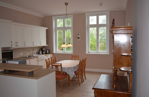 Hof Redentin Apartment | Scenic Swan Lake Retreat at Redentin Manor Awaits You