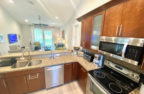 Lake Worth House | Discover Swans Nest East: Tropical Oasis with Heated Pool