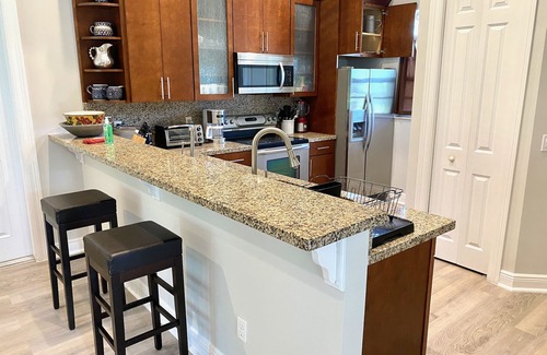 Lake Worth House | Discover Swans Nest East: Tropical Oasis with Heated Pool