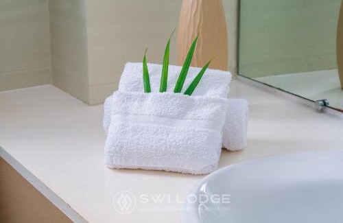 L'Autre-Bord Apartment | Experience SWILODGE: Oceanfront Views & Pool Access Await!